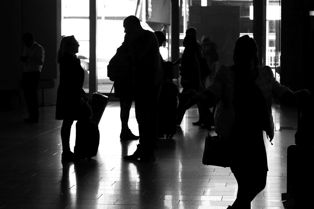 Individuals waiting at a station